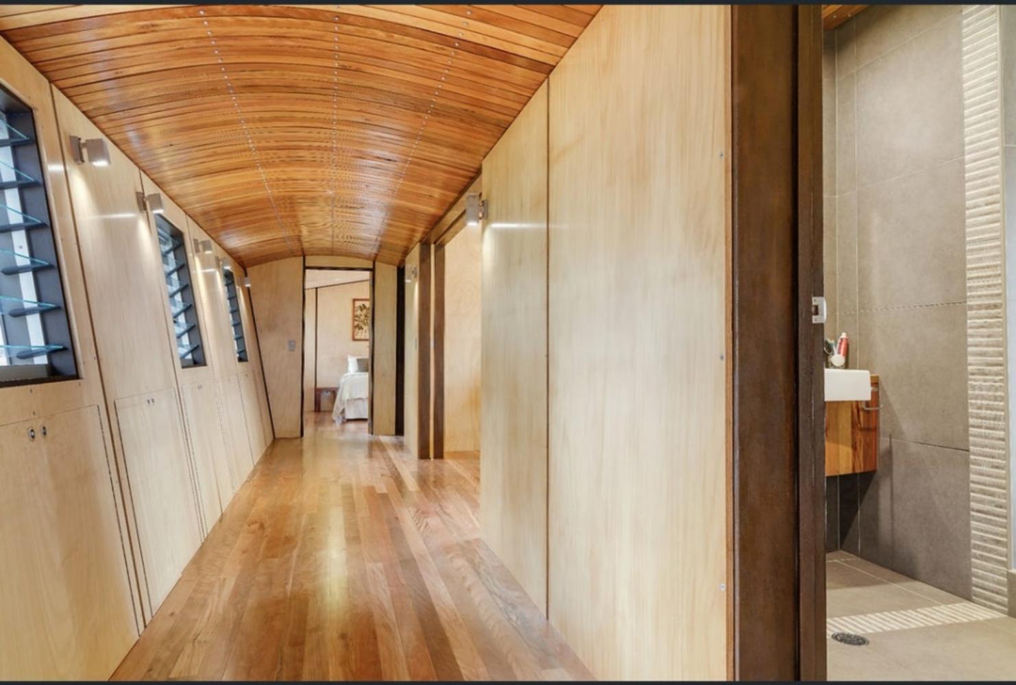 architecturally designed hallway leading to main bathroom, bedrooms 2 and 3, and laundry
