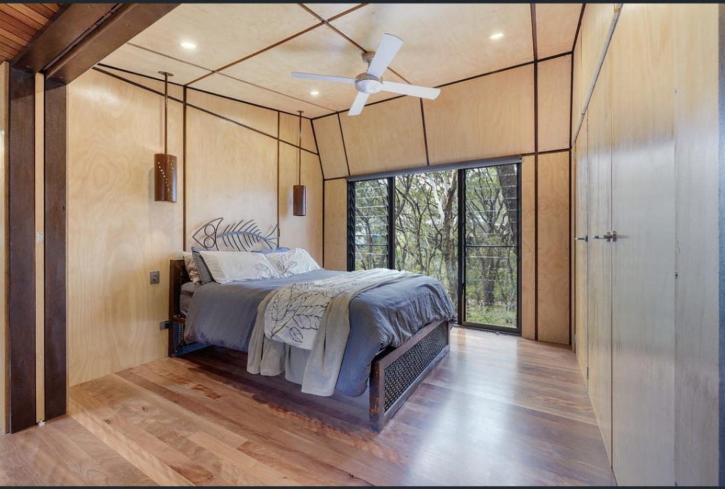 third bedroom with queen bed, built in robe and ceiling fan