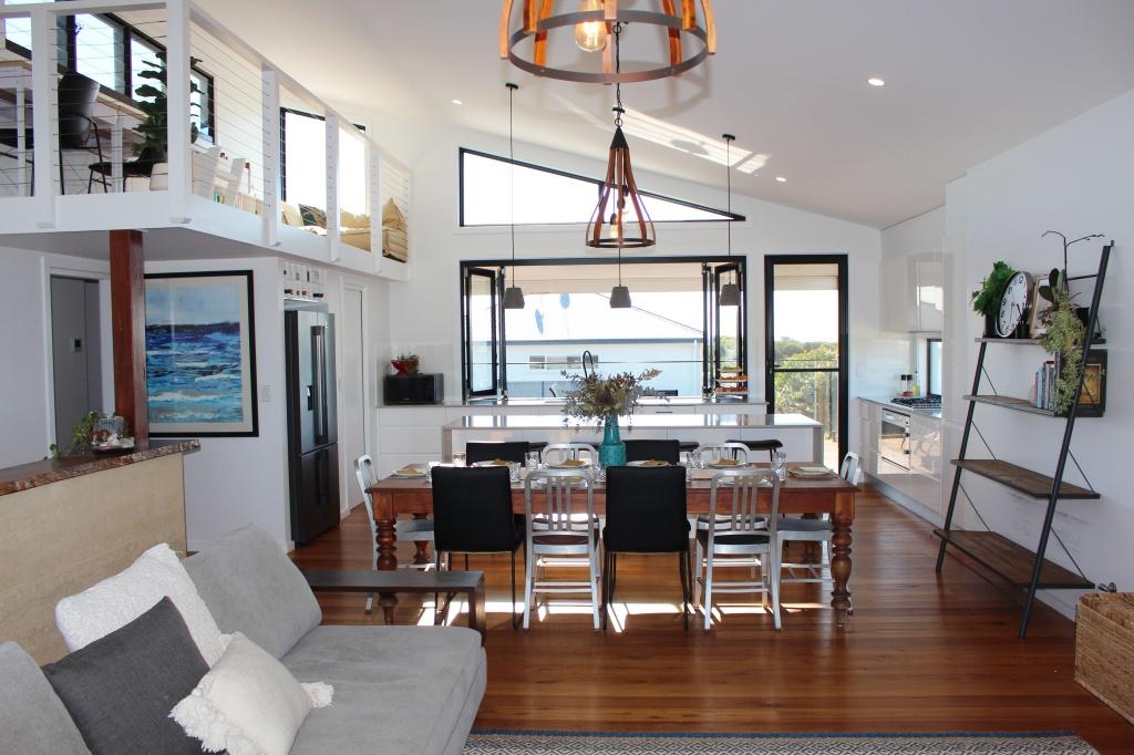 Open living, dining, kitchen and loft at Waterside Escape