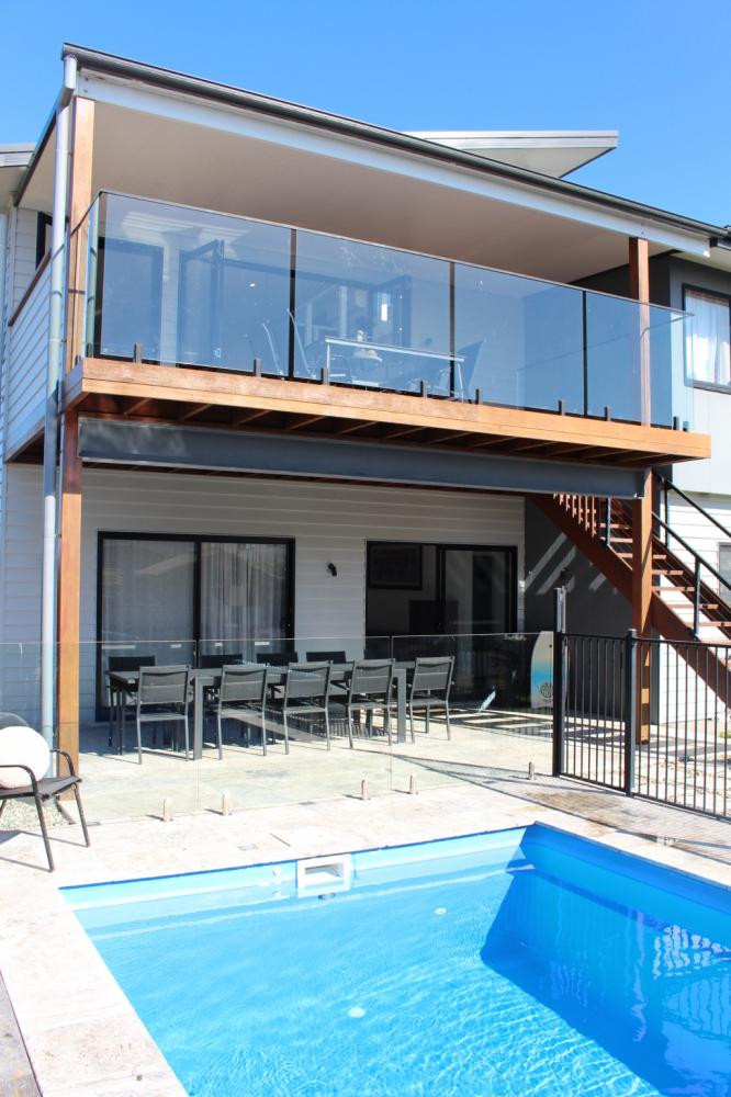 Luxurious heated pool with large deck at Waterside Escape