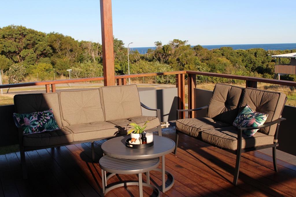 Large front deck with five seater outdoor lounge at Waterside Escape