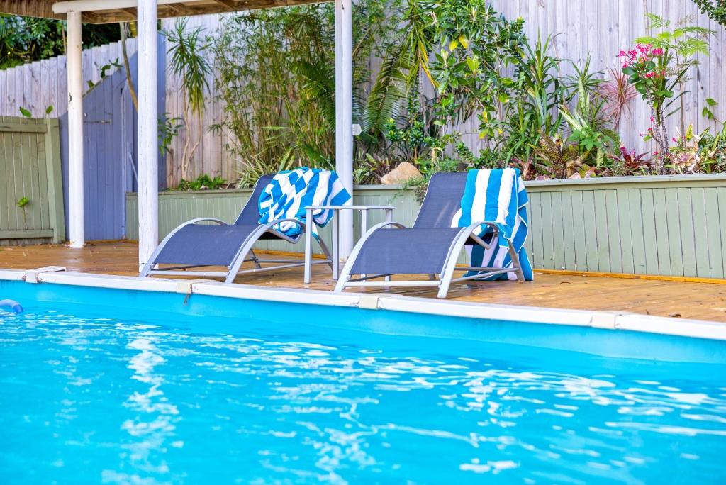 Beachside holiday rental in Port Macquarie with swimming pool, modern amenities, and spacious outdoor entertaining area. Short drive to Flynns Beach. Perfect coastal getaway for families and couples.