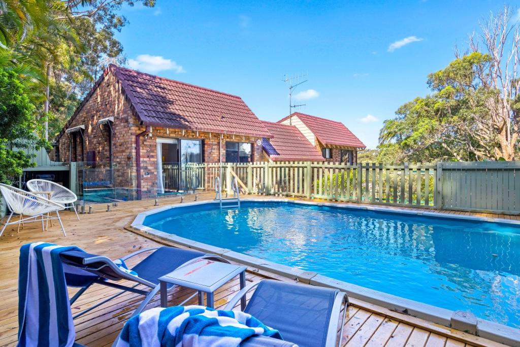 Beachside holiday rental in Port Macquarie with swimming pool, modern amenities, and spacious outdoor entertaining area. Short drive to Flynns Beach. Perfect coastal getaway for families and couples.