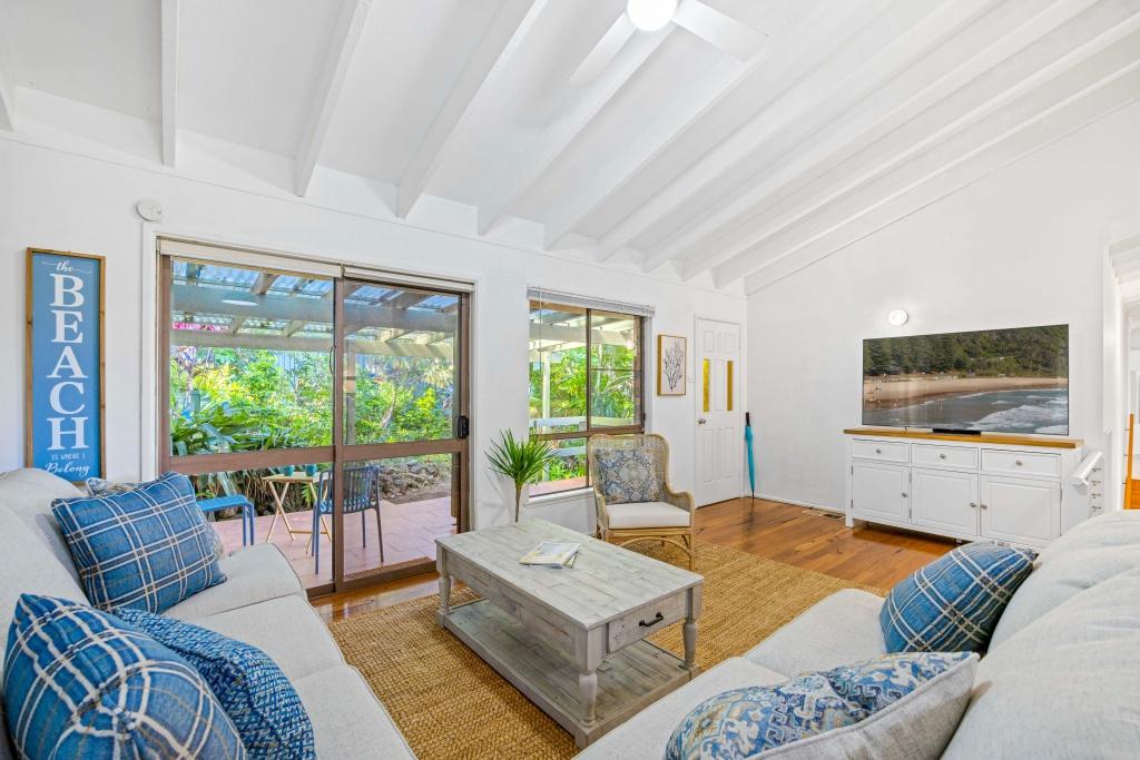 Beachside holiday rental in Port Macquarie with swimming pool, modern amenities, and spacious outdoor entertaining area. Short drive to Flynns Beach. Perfect coastal getaway for families and couples.