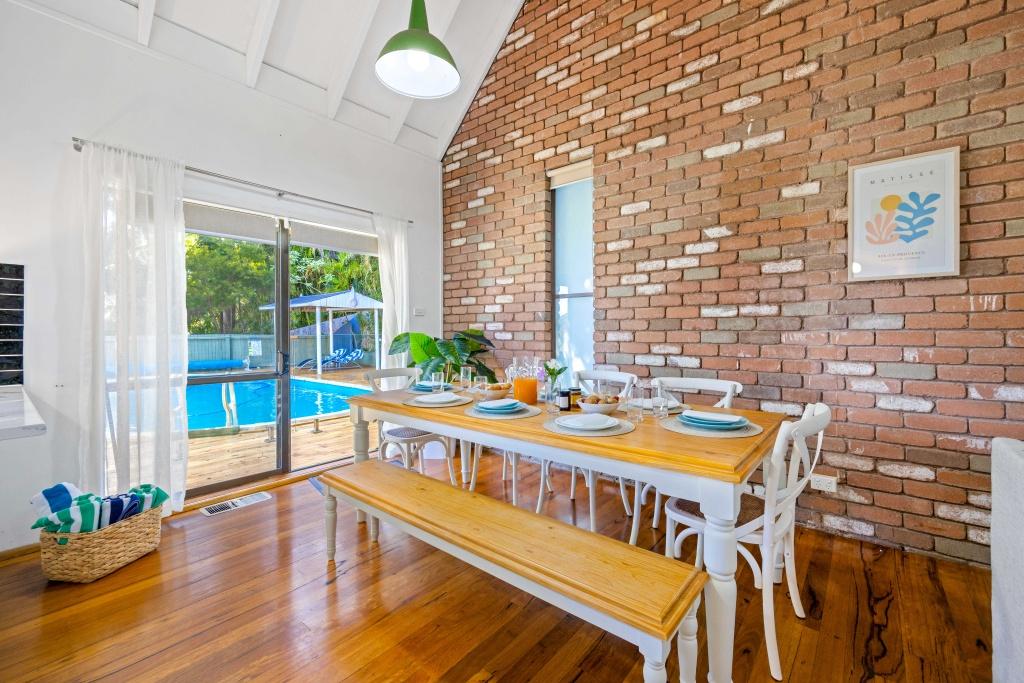 Beachside holiday rental in Port Macquarie with swimming pool, modern amenities, and spacious outdoor entertaining area. Short drive to Flynns Beach. Perfect coastal getaway for families and couples.