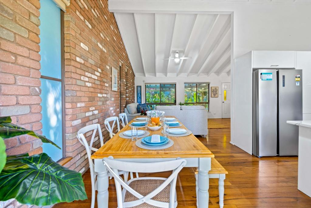 Beachside holiday rental in Port Macquarie with swimming pool, modern amenities, and spacious outdoor entertaining area. Short drive to Flynns Beach. Perfect coastal getaway for families and couples.