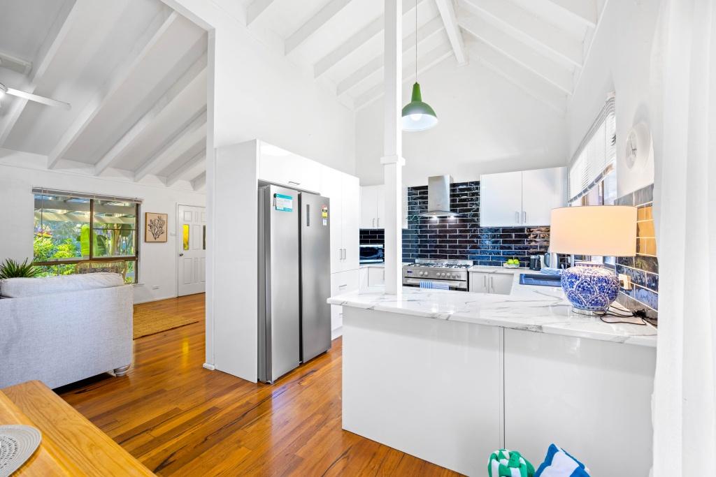 Beachside holiday rental in Port Macquarie with swimming pool, modern amenities, and spacious outdoor entertaining area. Short drive to Flynns Beach. Perfect coastal getaway for families and couples.