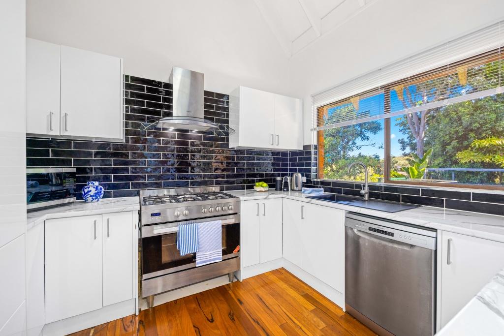 Beachside holiday rental in Port Macquarie with swimming pool, modern amenities, and spacious outdoor entertaining area. Short drive to Flynns Beach. Perfect coastal getaway for families and couples.