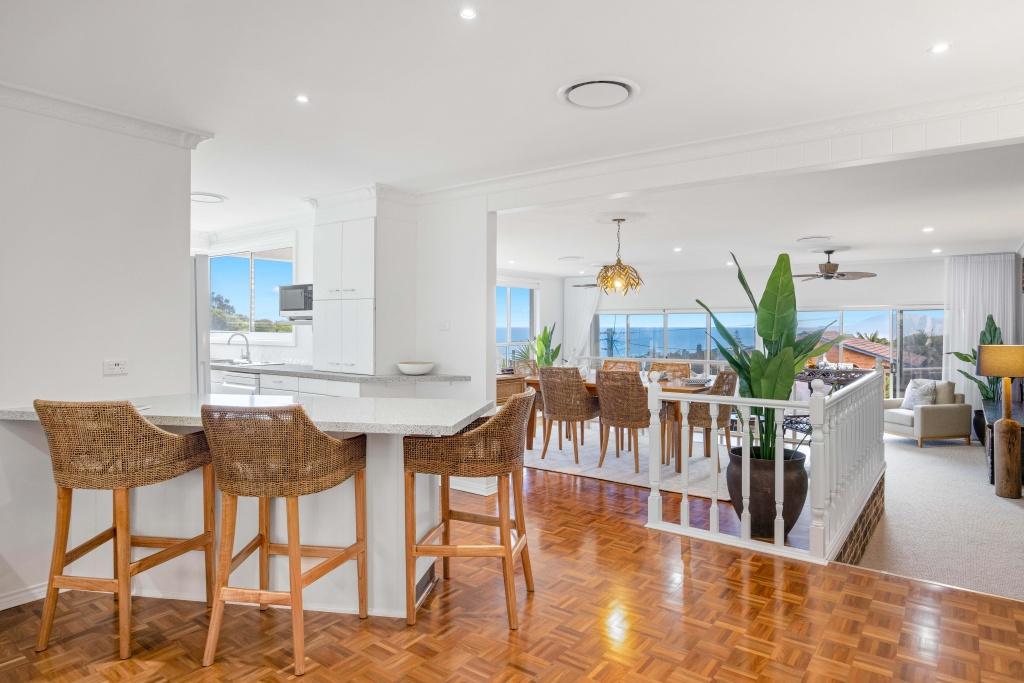 Open planing dining and lounge room with ceiling fan and ducted air conditioning at Beached at Lighthouse Port Macquarie