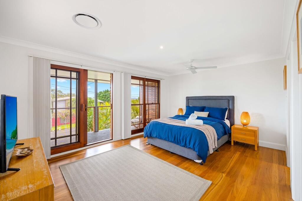 Main bedroom with private balcony, ensuite and walk in wardrobe. Illalangi