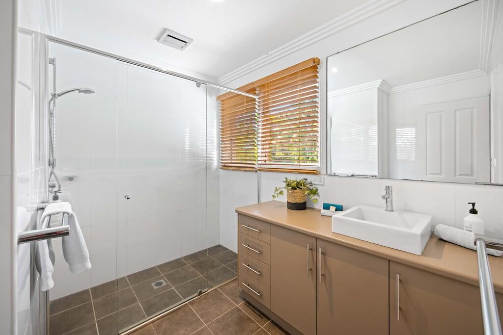 Second bathroom with vanity and walk in shower 